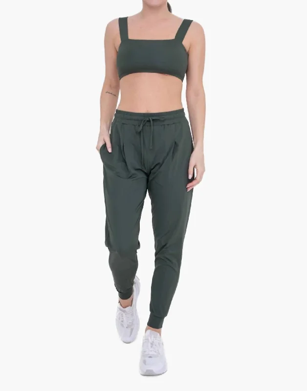 Striped women trousers with a nautical or modern patternSolid Pleated Front Joggers In Deep Forest