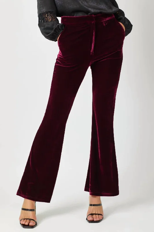 Printed women trousers with floral patterns for a feminine touchVelvet Flare Trousers In Merlot